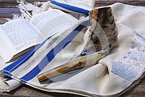 Shofar (horn) on white prayer talit. room for text. rosh hashanah (jewish holiday) concept . traditional holiday symbol.