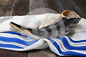 Shofar (horn) on white prayer talit. room for text. rosh hashanah (jewish holiday) concept . traditional holiday symbol.