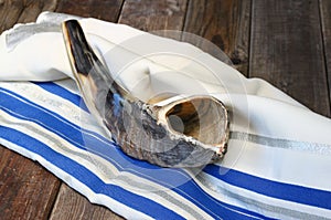 Shofar (horn) on white prayer talit. room for text. rosh hashanah (jewish holiday) concept . traditional holiday symbol.