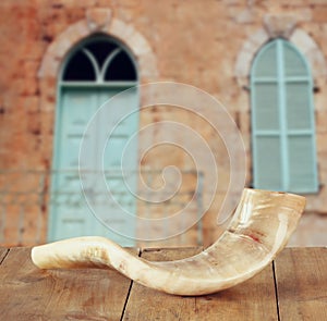 Shofar (horn) on wooden table. rosh hashanah (jewish holiday) concept . traditional holiday symbol.