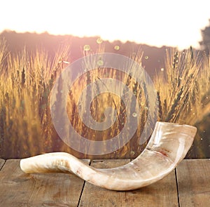 Shofar (horn) on wooden table. rosh hashanah (jewish holiday) concept . traditional holiday symbol.