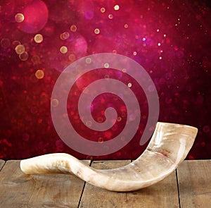 Shofar (horn) on wooden table. rosh hashanah (jewish holiday) concept . traditional holiday symbol.