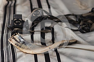 A shofar is placed on a tallit
