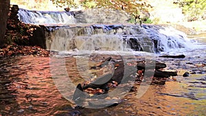 Shohola Falls middle section surrounded by brilliant fall foliage