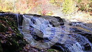 Shohola Falls middle section surrounded by brilliant fall foliage pans slowly right