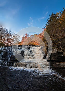 Shohola Falls in the Pennsylvania Poconos on a beautiful fall morning surrounded by peak fall foliage