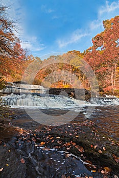 Shohola Falls in the Pennsylvania Poconos on a beautiful fall morning surrounded by peak fall foliage