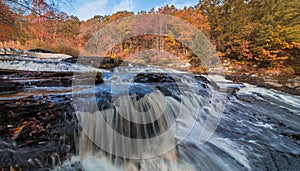 Shohola Falls in the Pennsylvania Poconos on a beautiful fall morning surrounded by peak fall foliage