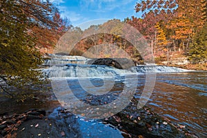 Shohola Falls in the Pennsylvania Poconos on a beautiful fall morning surrounded by peak fall foliage