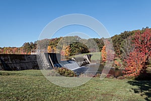 Shohola Lake and Dam on a calm fall morning with blue skies