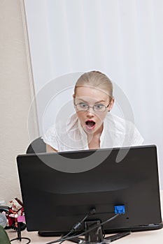 Shoked business woman working online photo