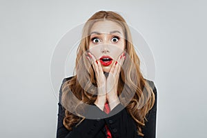 Shoked woman on white background portrait photo
