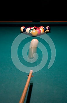 Shoot. Break racked pool balls