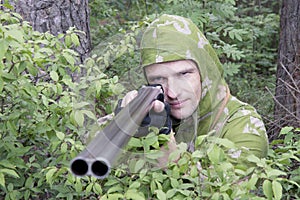 The shooter in camouflage photo