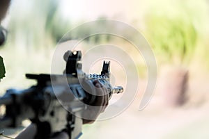 A shooter sighting in the target.