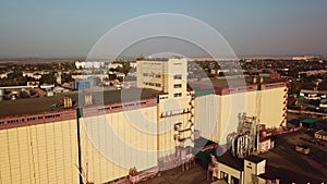 Shooting from above. flying over the old building of an abandoned grain Elevator