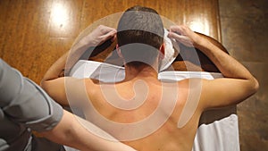 Shooting from above. man doing a shoulder and back massage,relaxing,relaxation