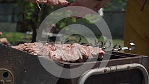 shooting close-up of barbecue grilling meat on the grill
