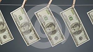 Shooting of dollars drying on clothesline rope