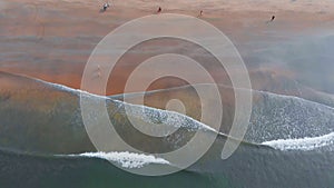 Shooting from the drone of the Arambol beach with tidal waves. Goa State. India.