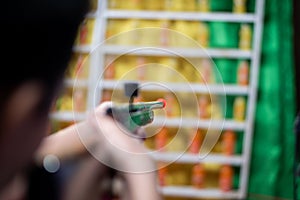 Shooting games at shops at Thai temple festivals