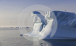 Shooting of ices at a short distance. An iceberg surface with thawing traces.