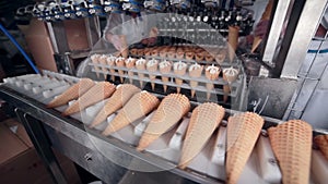 The shooting of the process of the ice-cream cones` production. No face. HD.