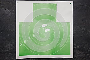 Shooting range gun. Paper target in white and green color for hit