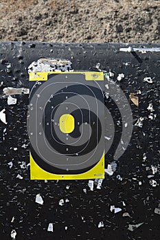 Shooting range target with bullet holes at a gun range