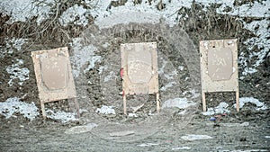 Shooting range target after shooting with shotgun bullet gauge pellets