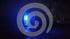 Shooting of rotating blue emergency light in the night