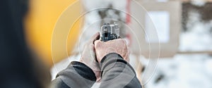 Shooting on target in shooting range. Back close-up detail view