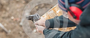 Shooting on target in shooting range. Back close-up detail view