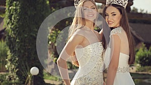 Shooting of two gorgeous girls in wedding dresses