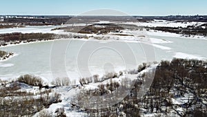 Shooting of winter landscape near the river during dron fly