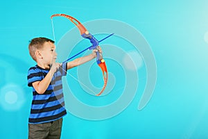 shoots a bow at a target on the blue backgrounds