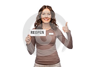 shop assistant with reopen sign showing thumbs up