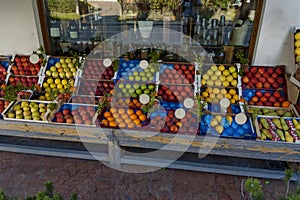 Shop with fresh fruit on the street, jam and alcoholic drinks inside, Cortina D`Ampezzo, Dolomites, Alps, Veneto