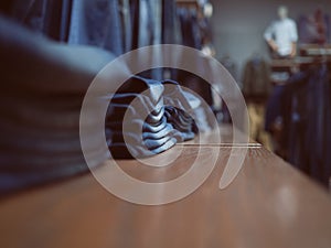 Shop of jeans clothes. Jeans fashion store on a shelf. Neatly folded clothes. Concept on casual clothes shopping.