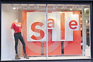 Shop Mall Sale Sign on Window with Female Mannequin