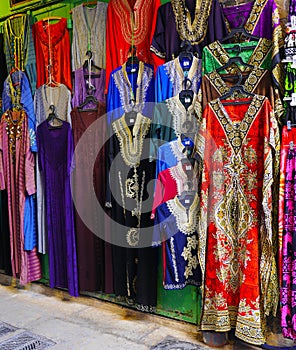 Shop in the old town of Jerusalem with large variety of colorful dresses