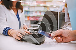 Shop payment by contactless creditcard and POS in a store photo