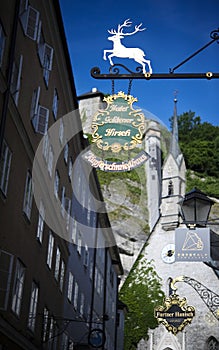 Shop sign Hotel Goldener Hirsch in the Getreidegasse in Salzburg