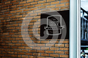 Shop signage mockup on a brick wall