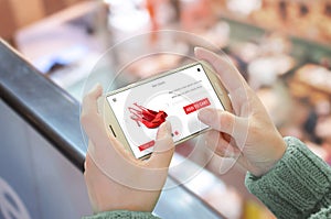 Shop with smart phone. Mobile in horizontal position in woman hand