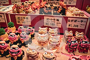 Shop with souvenir statues of Japanese mythical dog Shisa in Naha Okinawa