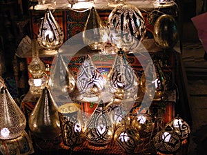 Shop vendor selling copper lamps in khan el khalili souq market in egypt cairo