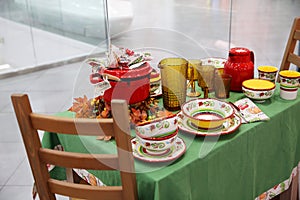 Shop window beautiful dishes on the table on sale photo