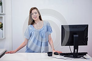 Shop worker standing by the till