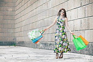 Shopaholic. Shopping love. Beautiful happy woman with bags.